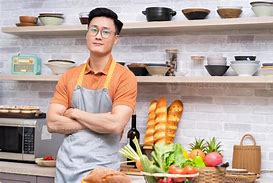 A smiling chef in a kitchen